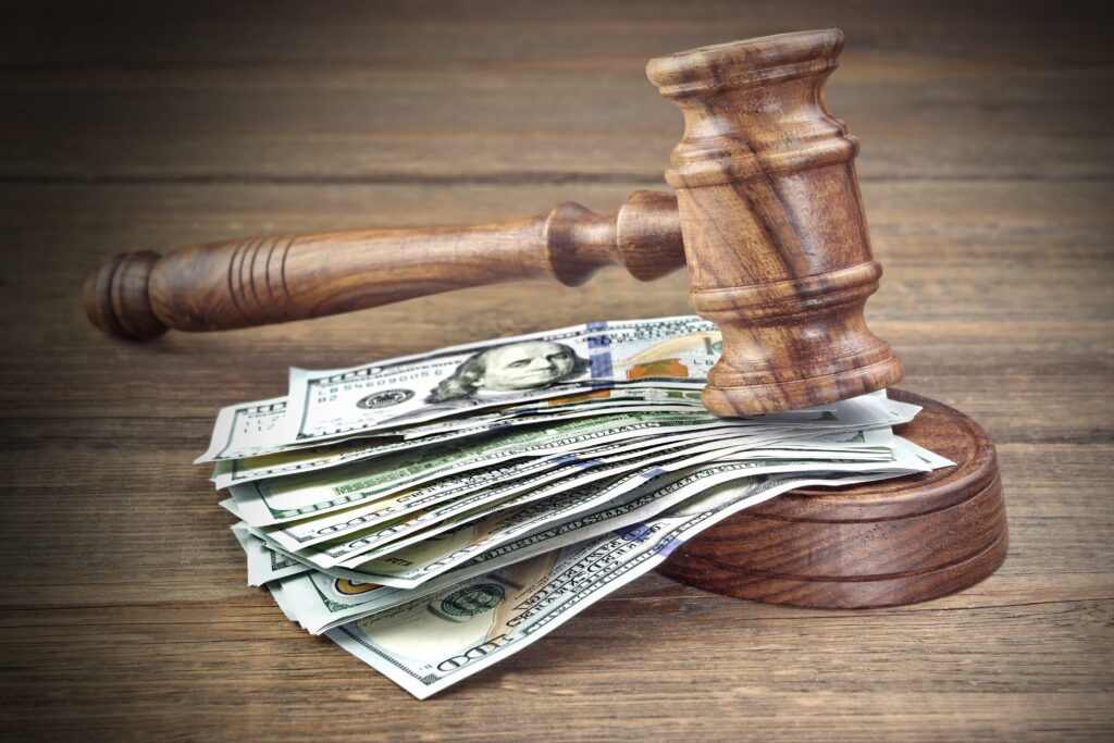 The Benefits of Litigation Financing. Money under a gavel.